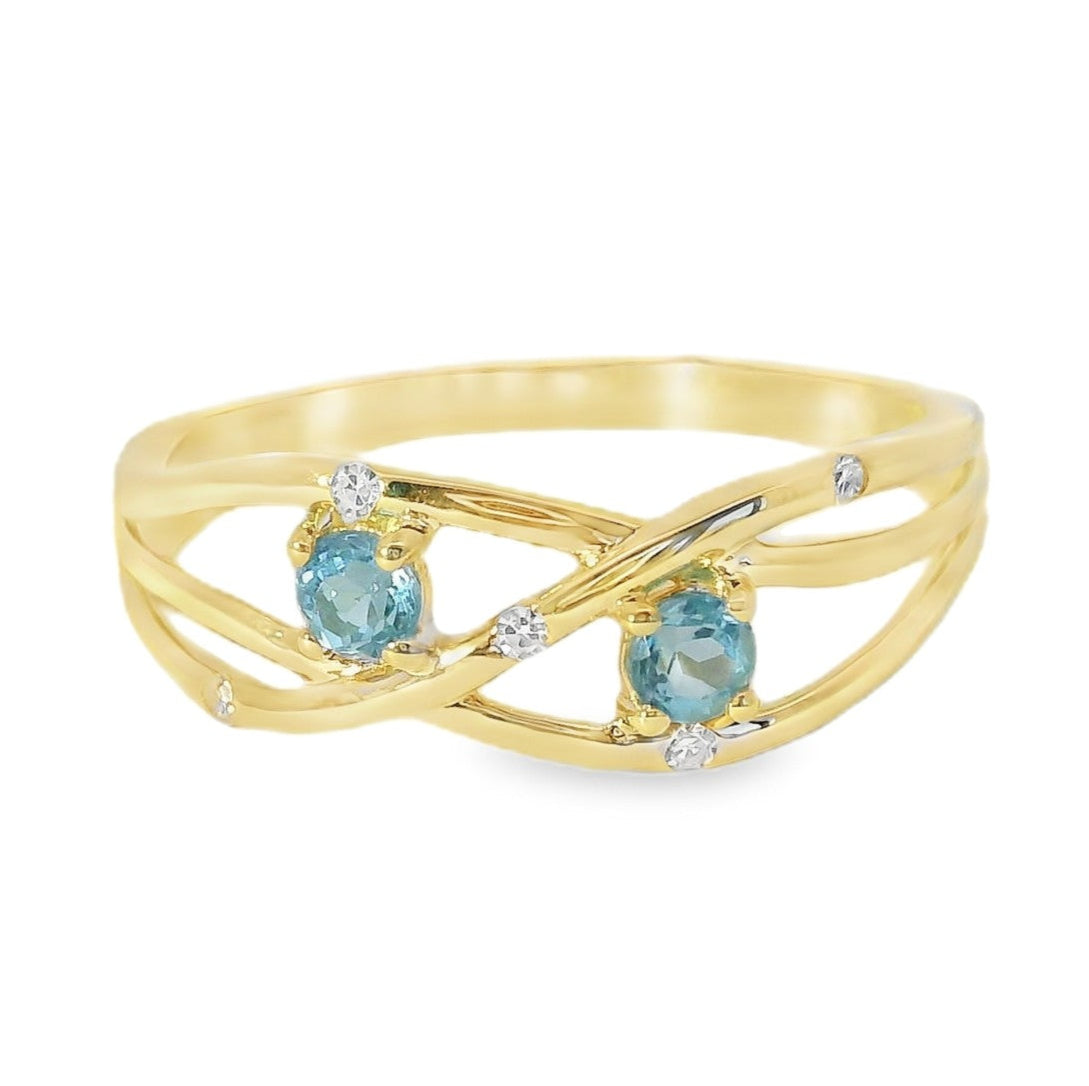 ANILLO 18KT 5 BR 2 TOPACIOS